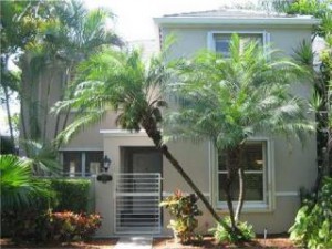 Bridgepoint Townhomes in South Miami with 24-hour security, lovely lake, and amenities.